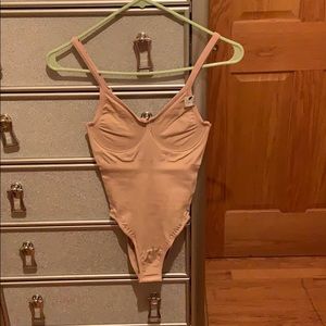 A Tummy Tuck Bodysuit-Shapewear